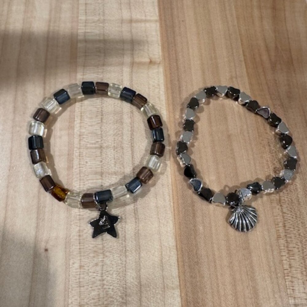 Set of two matching handmade beaded bracelets with sea shell and starfish charms